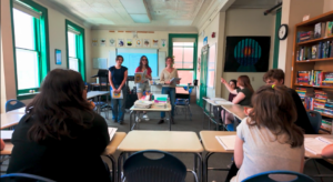 Cornell students and high schoolers in classroom